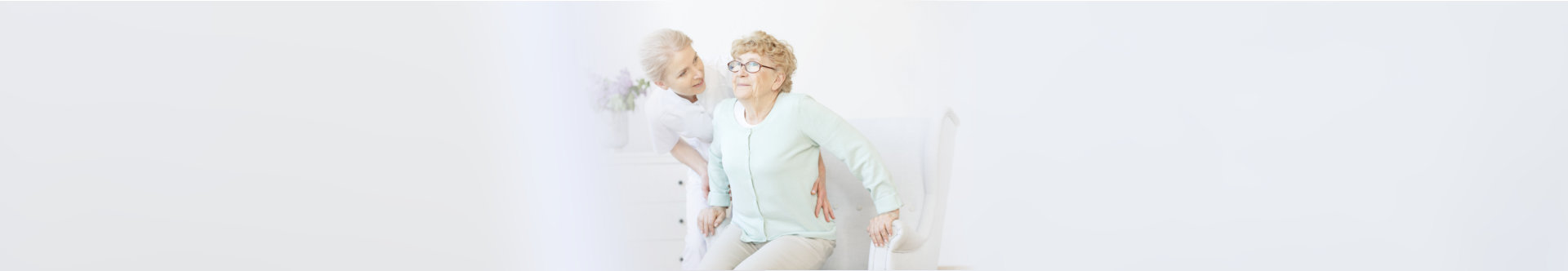 caregiver assisting a senior patient